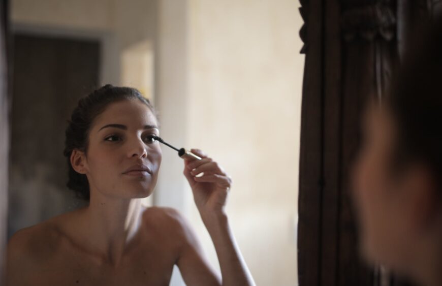 woman applying mascara